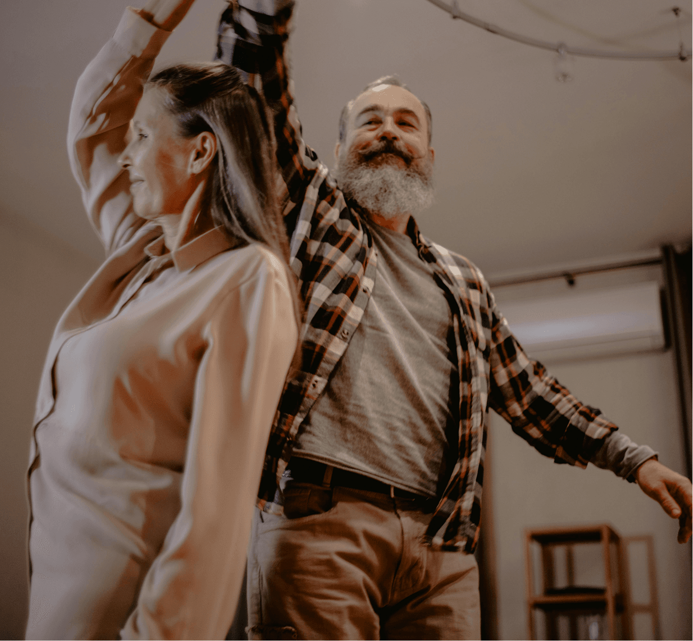 Senior couple dancing together, comfortable and active.